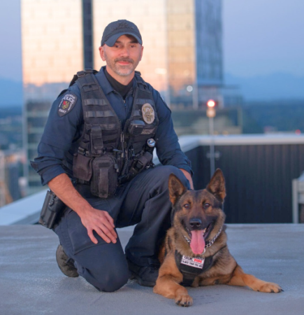 K9 Walter poses for a photo with his handler, Officer Ben Bradley.